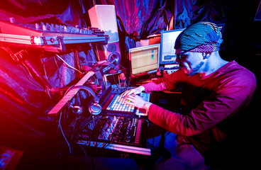 Sound engineer working at mixing panel in the in sound recording studio.