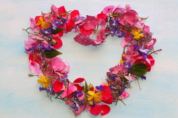 Lovely floral heart of flowers. Summer frame 