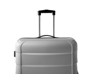 Gray suitcase packed for journey on white background