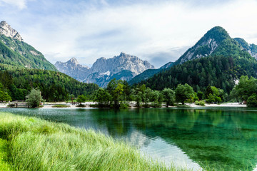 Fototapeta na wymiar Scenic view of the jasna Lake with Julian Alps in the background near Krajnska Gora, Slovenia