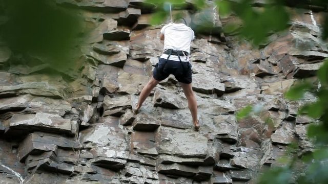 Young man on a rock climbing