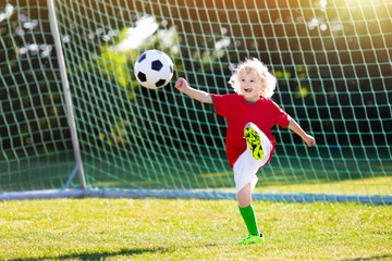 Obraz na płótnie Canvas Portugal football fan kids. Children play soccer.