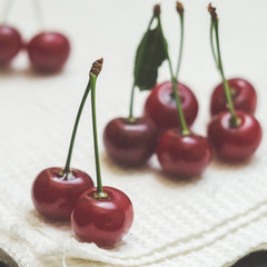 Ripe cherries on a white napkin