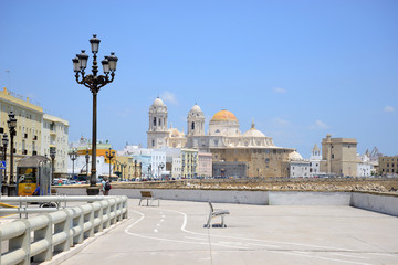 Fototapeta na wymiar Cádiz, Spain - June 21, 2018: Paseo del Vendaval and the Cathedral of Cadiz in the background.
