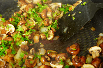 Fried mushrooms in a frying pan