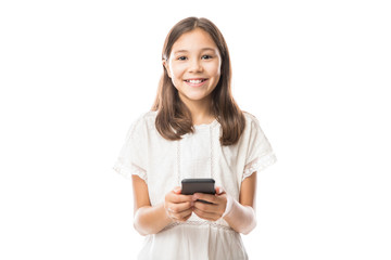 Portrait of a smiling girl using smartphone isolated on a white background