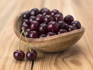 cherry berries on a wooden table. 