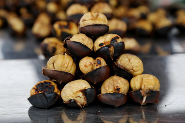  Fried chestnuts on the street. Street food. Roasted chestnuts