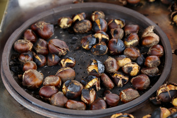  Fried chestnuts on the street. Street food. Roasted chestnuts