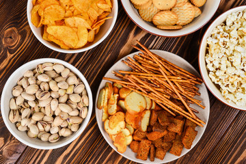 Snacks on a wooden background. Space for text or design.