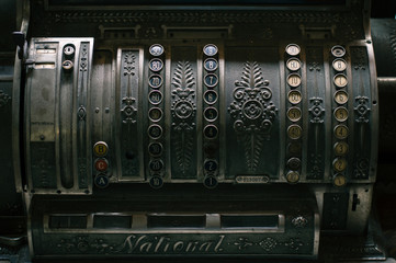 Closeup of an antique cash register located in a room within the concept of money. Instagram filter.