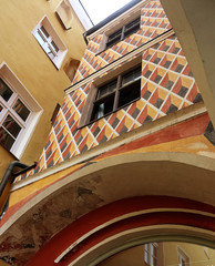 Detail of the  well preserved and colorful facade of a medieval building in the old town of Wasserburg am Inn, Upper Bavaria, Germany