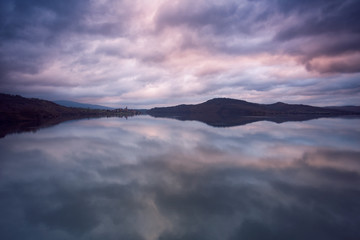 Dramatic clouds over Ullibarri Ganboa town in Alava