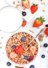 Bowl of healthy cereal granola with strawberries