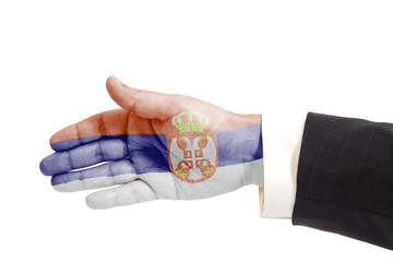 Handshake gesture businessman hand with Serbia flag