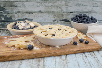Homemade small individual blueberry pies with fresh summer blueberries