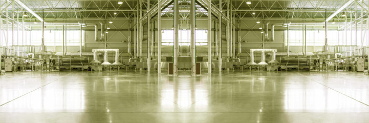 Blurred and defocused industrial concept collage. Toned. Piece of empty typical industrial space. Concept of manufacture, warehouse, storage, factory space. Copy space. Wide panoramic image. 