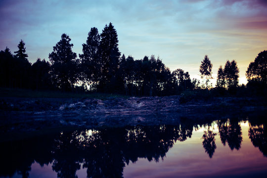 Amazing evening .reflection in the lake. Blur vintage effect. © Lelde Feldmane