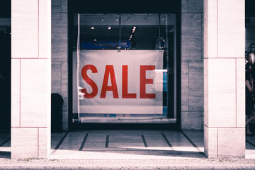 Sale - shopping window, store display the word sale -