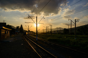 Fototapeta na wymiar Sunset landscape with railroad tracks, Vanadzor