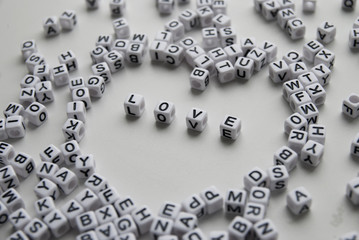 love  word written on cubes on white background. Creative text for your business. Chaotic letters design