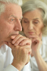Sad Senior couple at home 