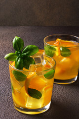 Glass of fresh orange juice with fresh fruits