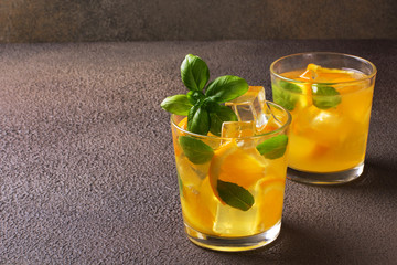 Glass of fresh orange juice with fresh fruits