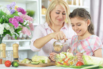 mother and daughter cooking together