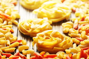 Tagliatelle nests and color pasta close up