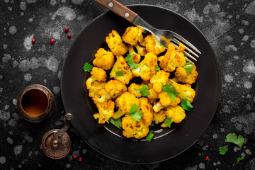 Roast turmeric cauliflower, bright vegetarian snack, tasty food © maria_lapina