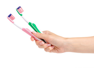 Two toothbrushes in hand on white background isolation