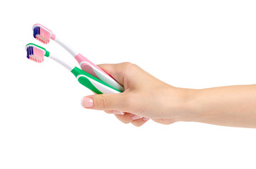 Two toothbrushes in hand on white background isolation