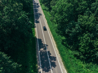 aerial view of straight highway. sunny day. car travel concept