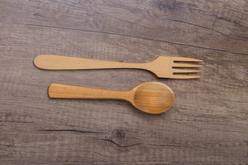 Wooden spoon and fork on table