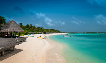 Tropical beach with palms on the background of the island	