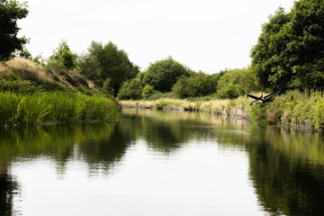 Fototapeta na wymiar Wild Canal view in England. Summer time