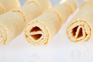 Wafer rolls. Gtoup of tasty crispy tube wafer on white background. Dessert