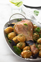 Roast turkey drumsticks with fried potatoes, basil. Holiday dinner. Copy space.