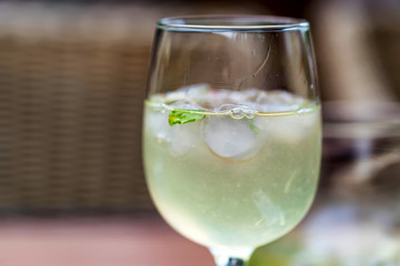 Refreshing Mojito cocktail in glass close