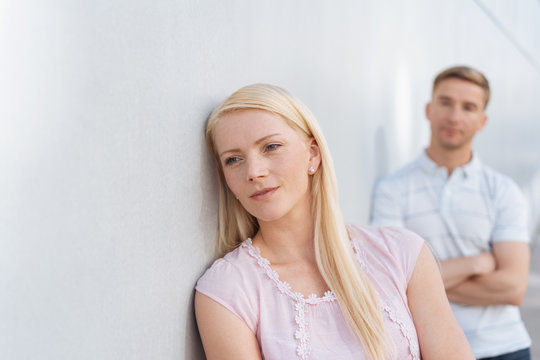 Pretty blond woman deep in thought