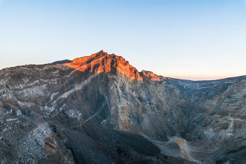 Naklejka premium Sunrise shining on the top of Mount Agung, the stratovolcano from the Crater Rim before eruption, Bali, Indonesia