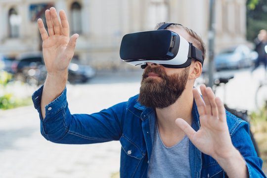 Bearded man using a 3d virtual reality headset