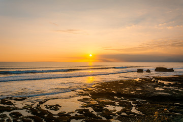 Fototapeta na wymiar Sunset from Gadon beach near Tanah Lot Temple in Bali, Indonesia