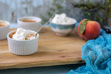 Individual Peach Cobbler in Ramekins; Homemade; Topped with Whipped Cream