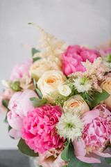 beautiful summer bouquet. flower arrangement with peonies. Color light pink. The concept of a flower shop.