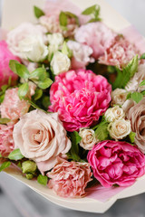 beautiful summer bouquet. flower arrangement with peonies. Color light pink. The concept of a flower shop.