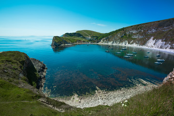 the famous circular bay of Lulworth Cove in the south of England