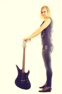 Blonde girl with electric guitar.