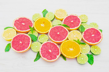 group of pink grapefruits, lime, orange and lemons 